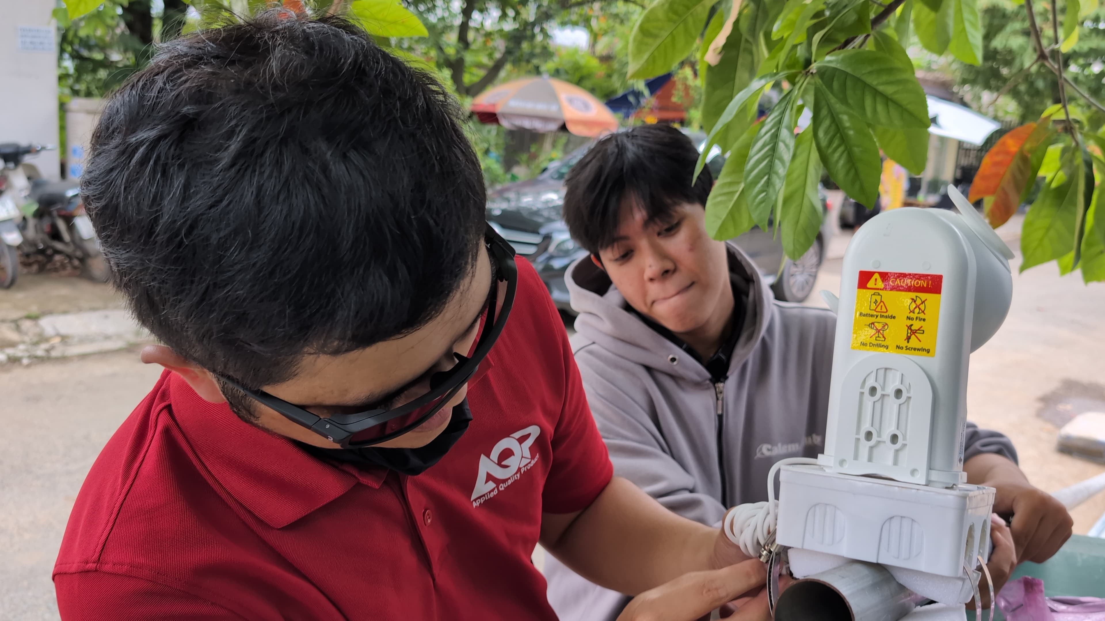 People working with connected equipment in the field